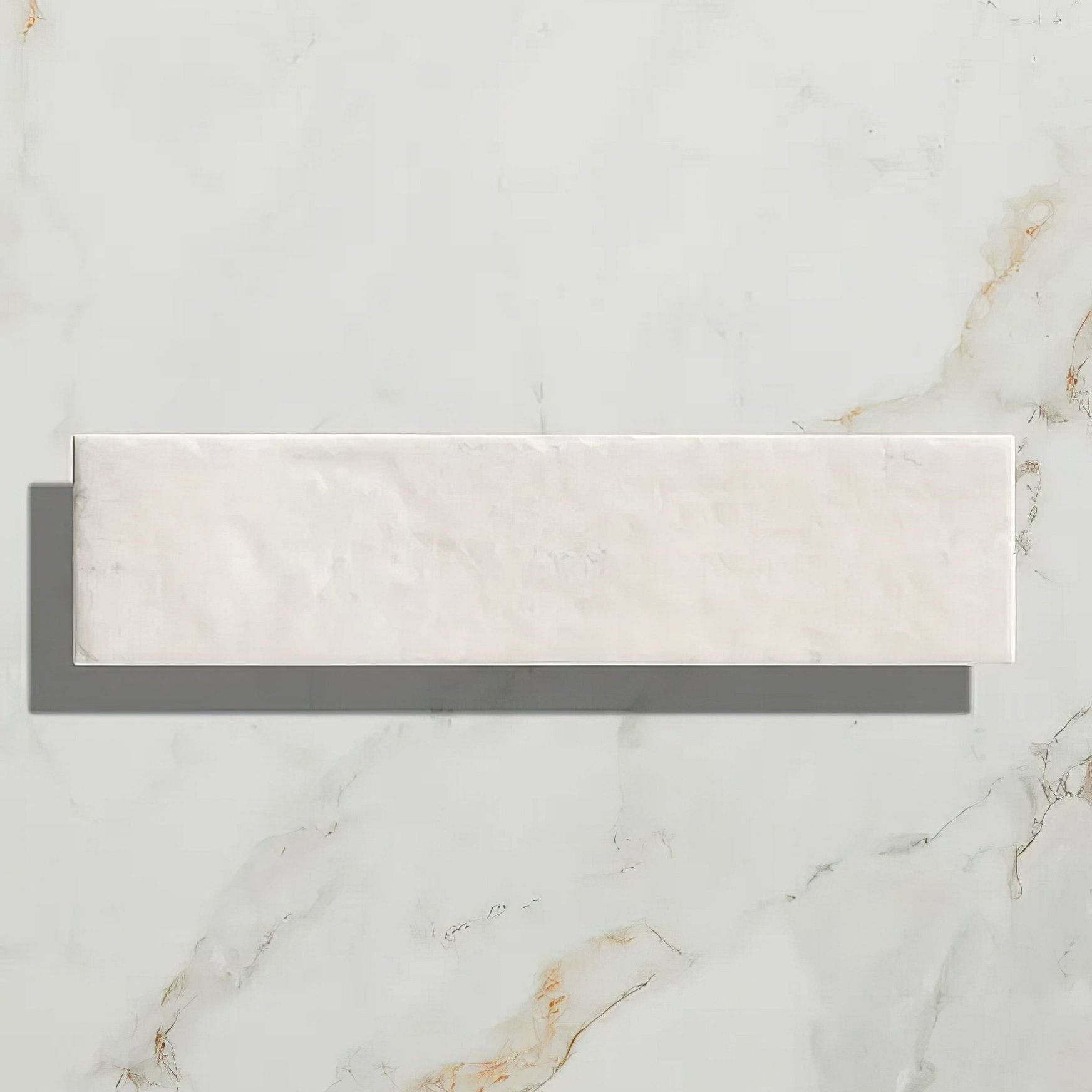 A sleek rectangular white marble porcelain parquet tile with subtle golden veining in cotton white gloss finish