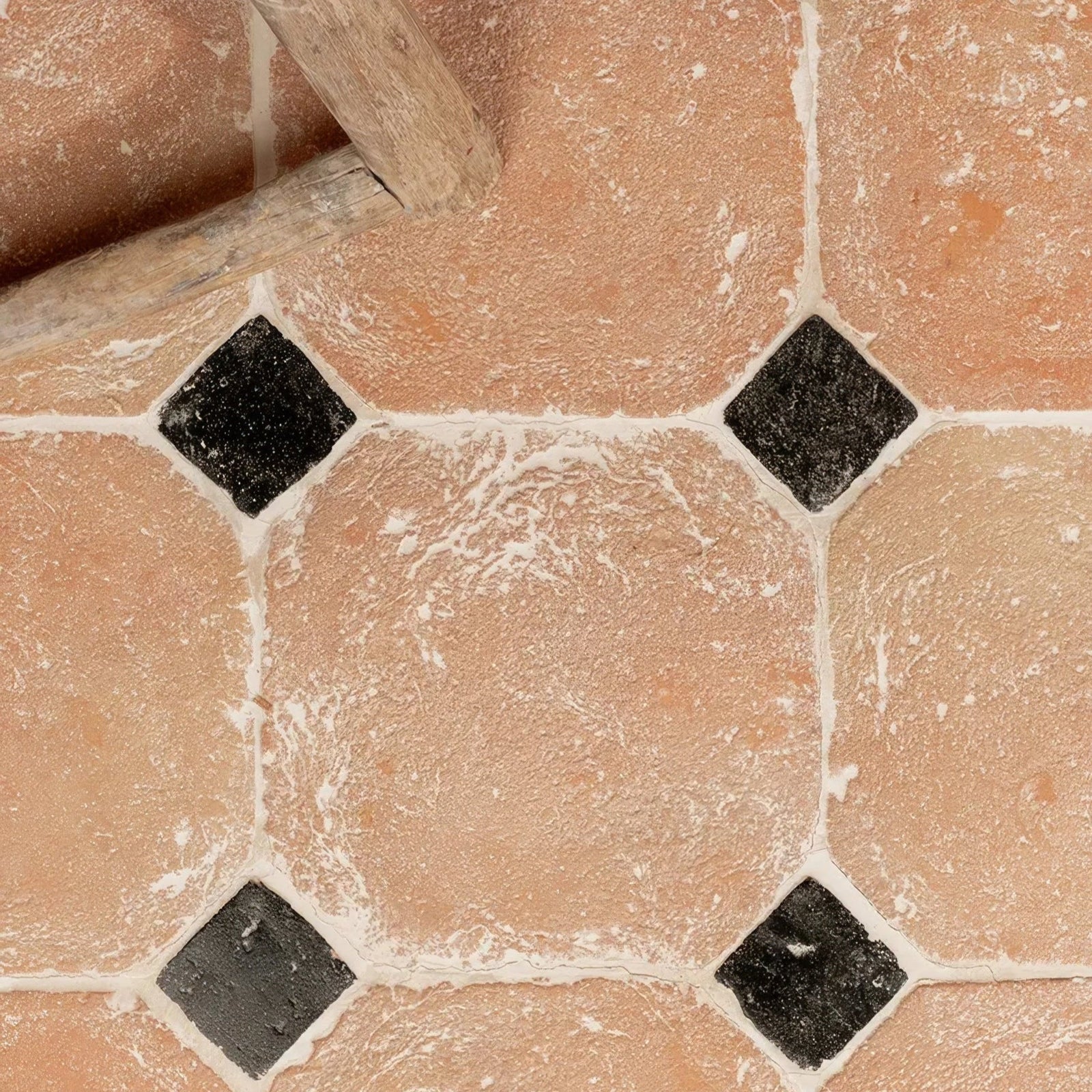 Marlborough terracotta octagons and cabochons floor tiles with diamond shaped black accent pattern