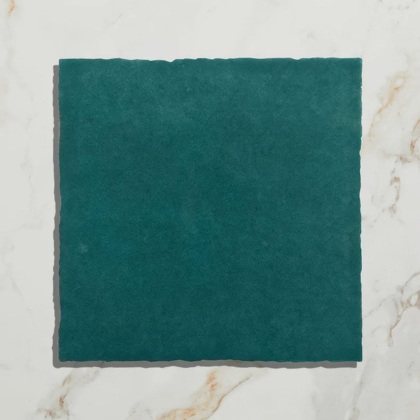 Teal green textured maroc ceramic aquamarine tile with hand cut irregular edges for decorative use