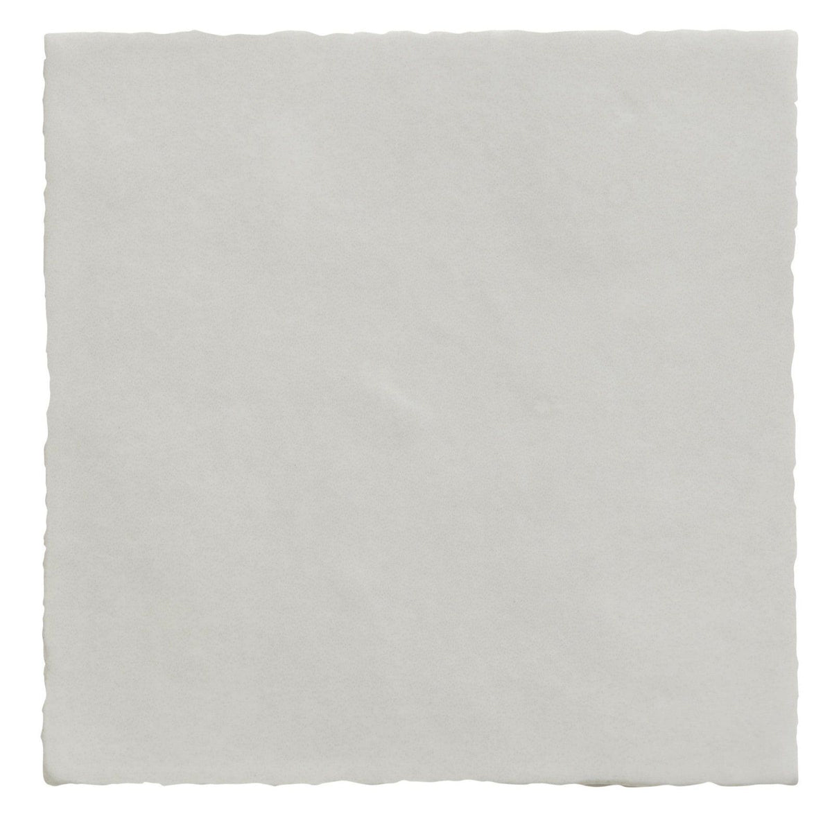 A square off-white ceramic tile with subtly textured surface and uneven edges from maroc ceramic bianco collection