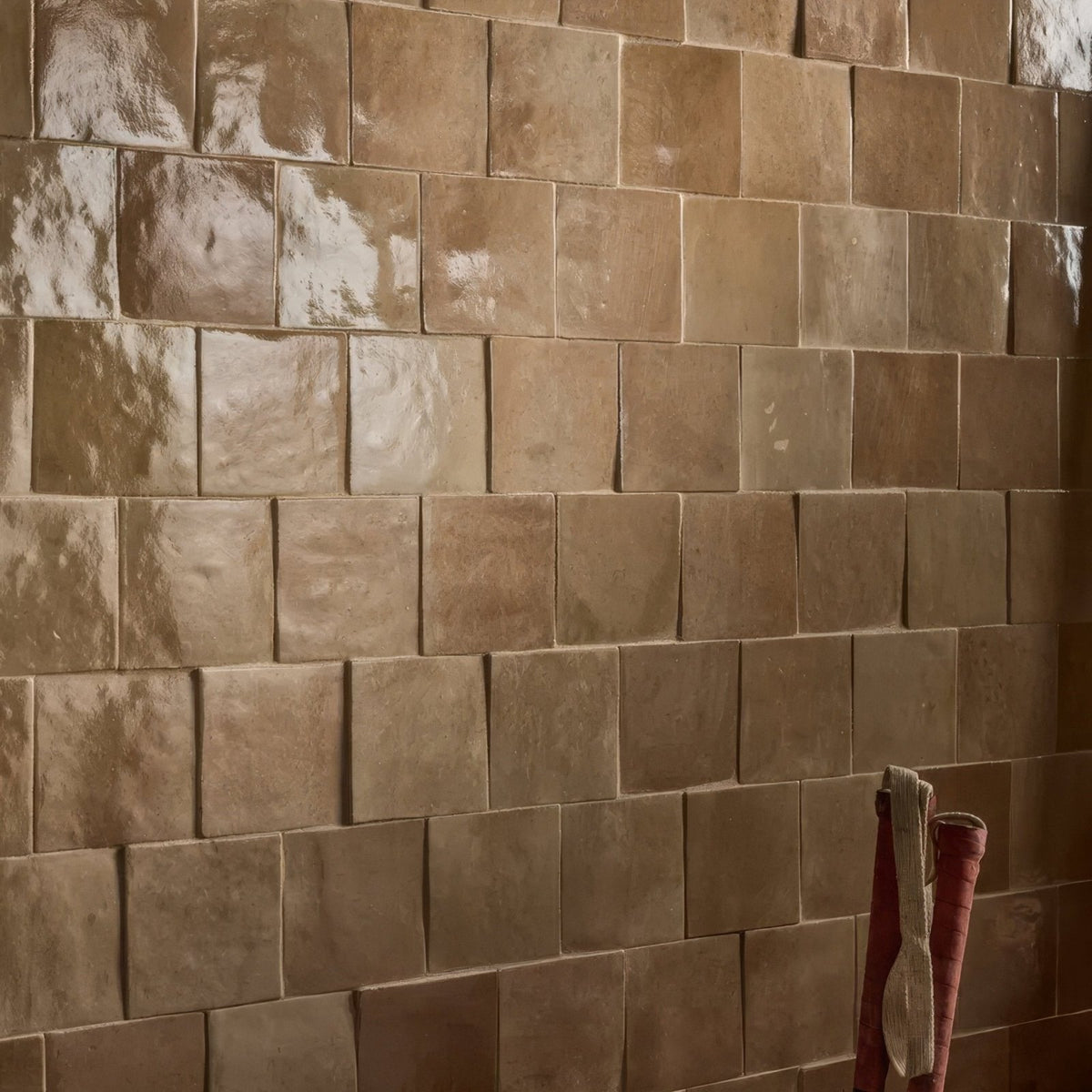 Tan glossy ceramic tiles with subtle texture from maroc ceramic caramel collection for stylish interior use