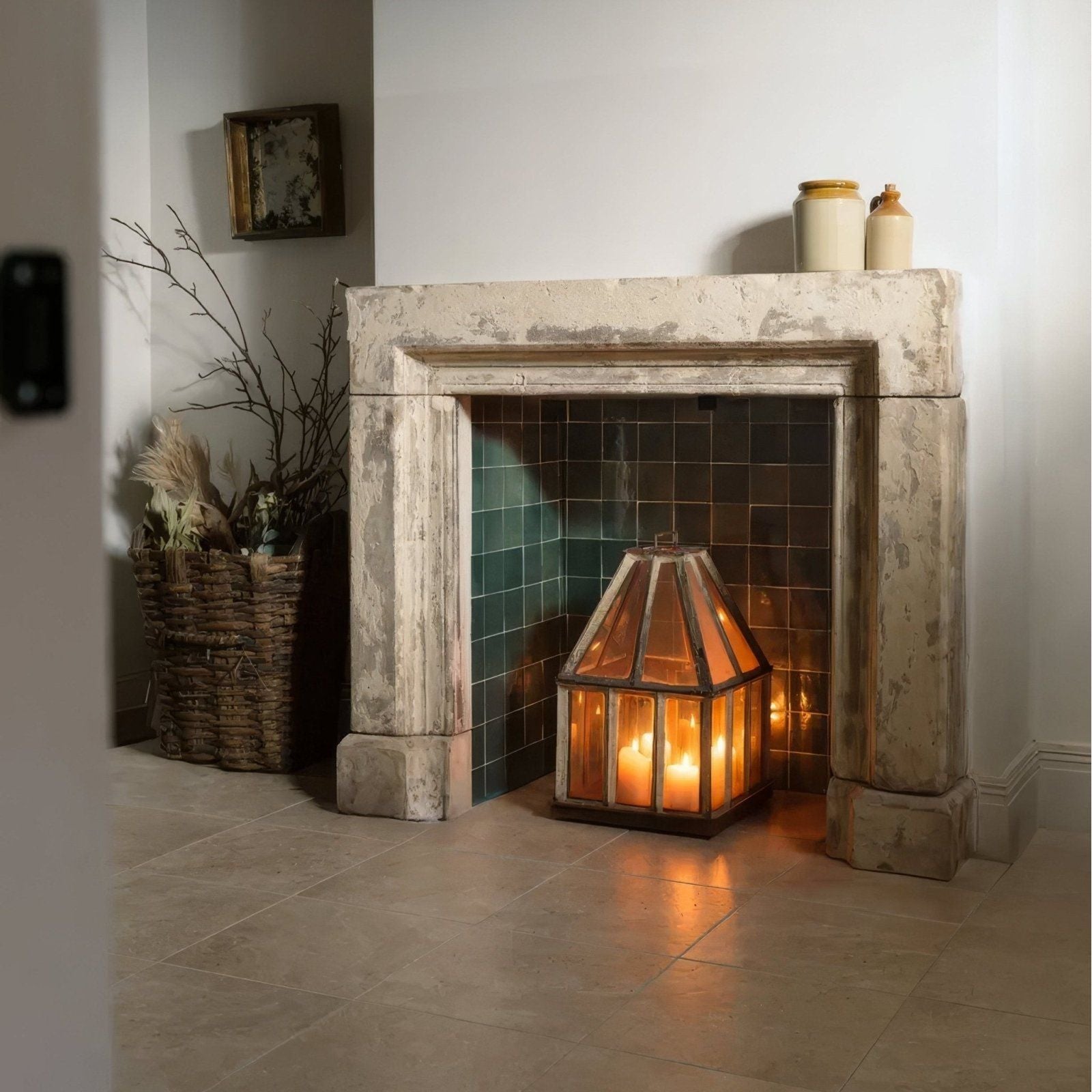 A geometric glass lantern with amber glow and leaded panes in a dark metal frame from maroc ceramic forest