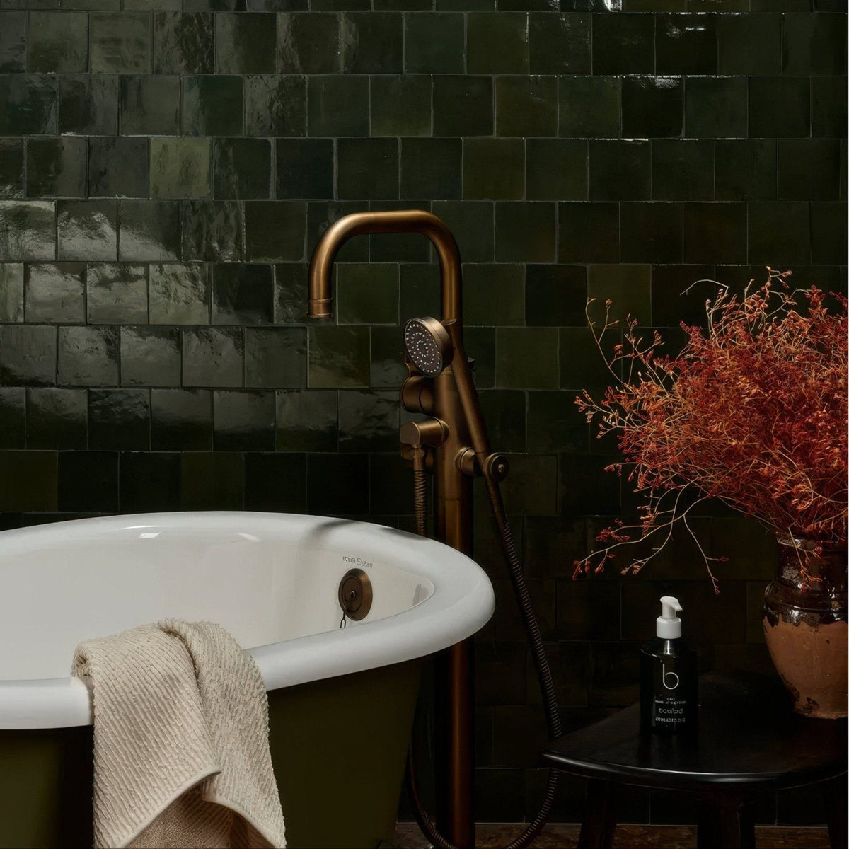 Antique brass bathtub faucet with curved spout and handheld showerhead from maroc ceramic forest collection