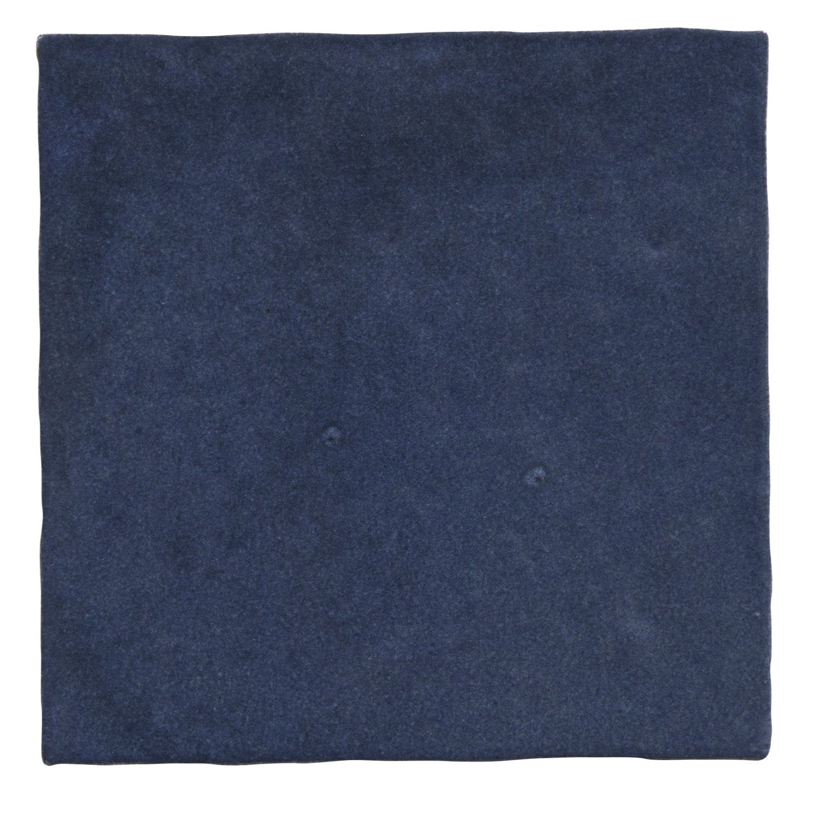 Dark blue suede square napkin complementing maroc ceramic oltremare dinnerware collection