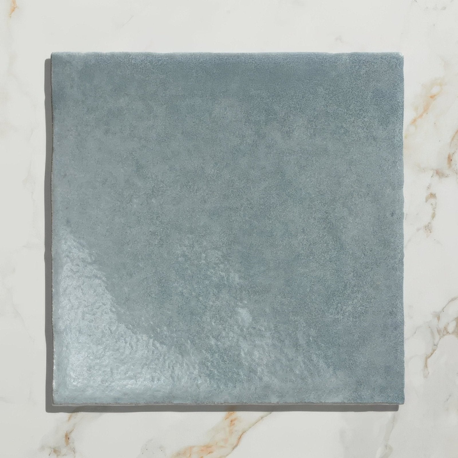 Maroc ceramic powder blue square tile in slate blue ceramic with a matte finish and subtly textured surface