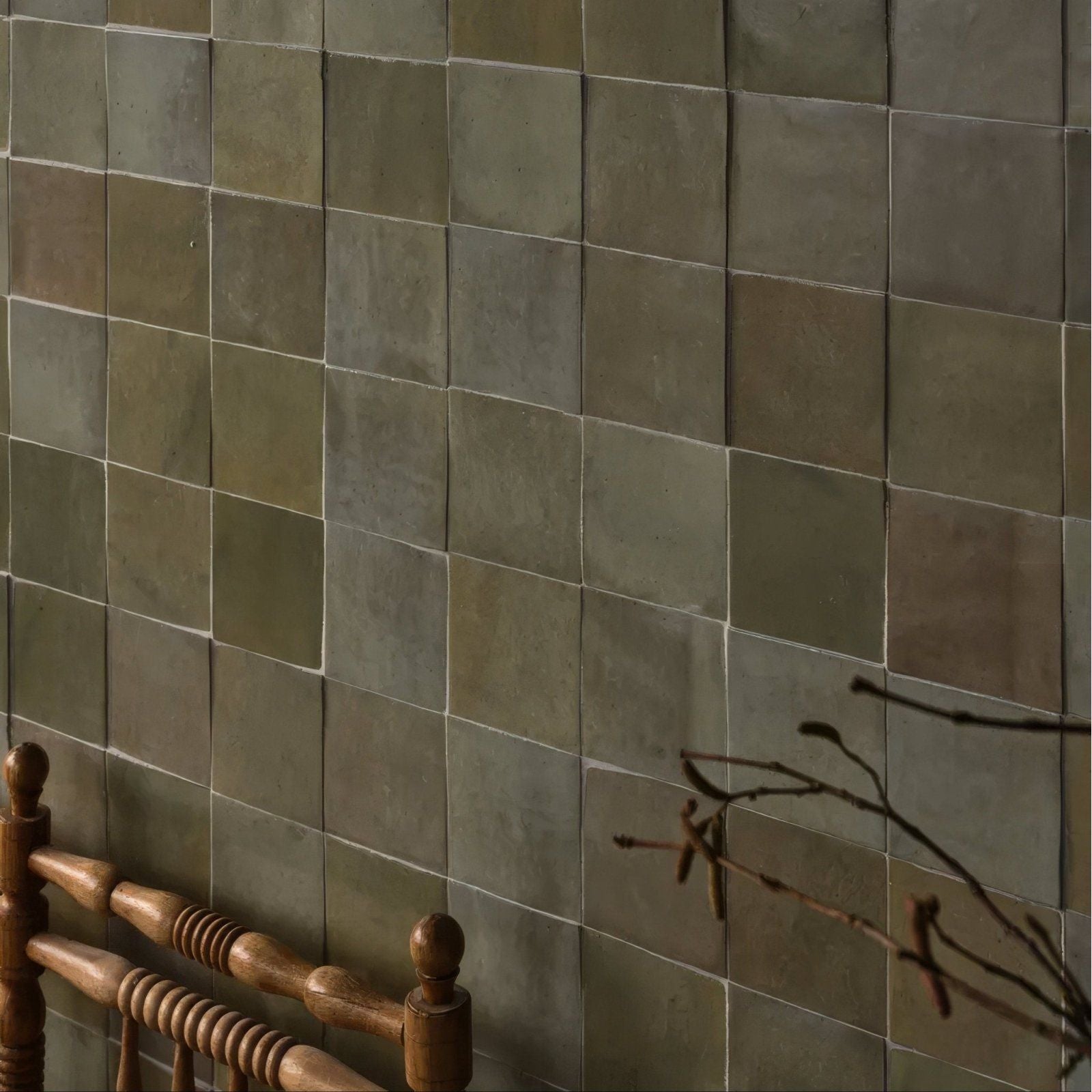 Earthy-toned maroc ceramic sage square ceramic tiles in muted green and gray hues arranged in a grid pattern