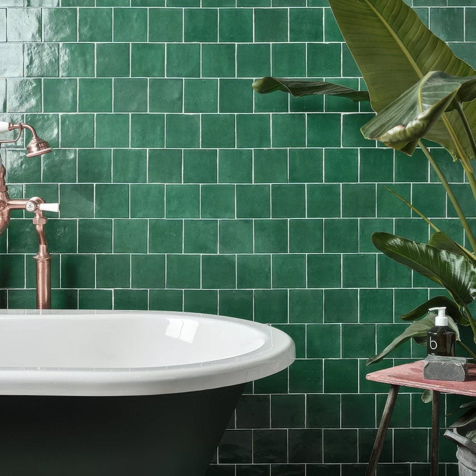 Maroc ceramic teal deep green rectangular matte textured wall tiles behind black clawfoot bathtub