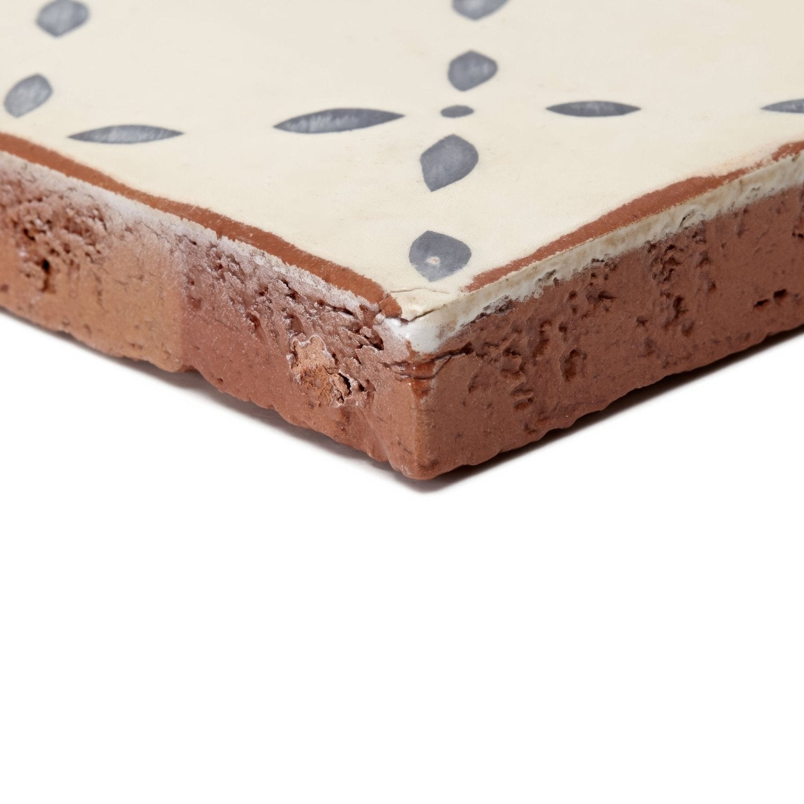 Cream-colored ceramic Marrakech El Hara patterned terracotta tile with rustic textured edge and subtle gray leaf design