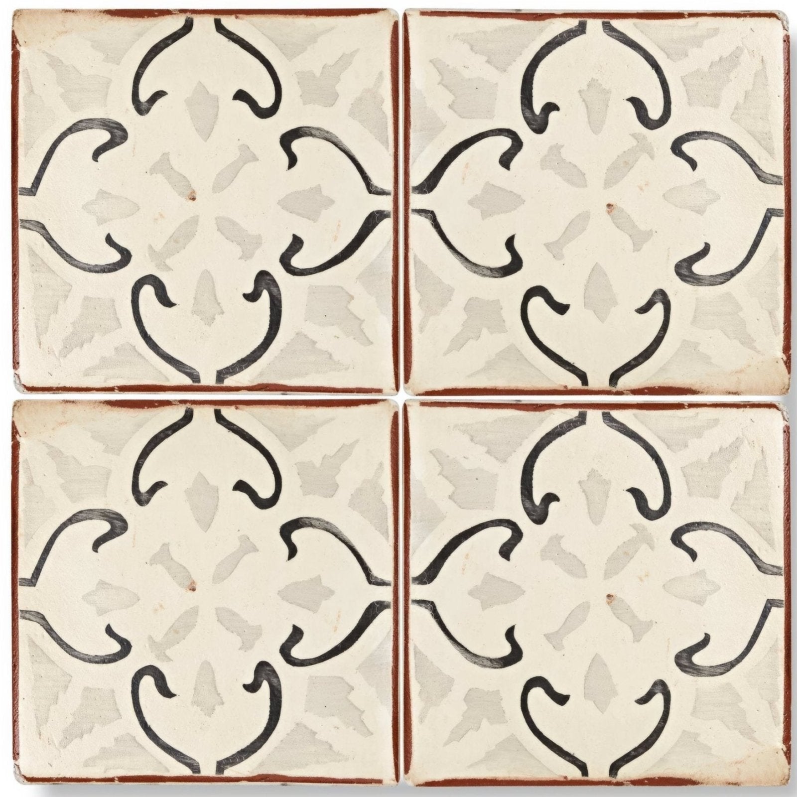 Cream-colored Marrakech Mabrouka patterned terracotta tile with black hand-painted floral patterns and rustic brown border