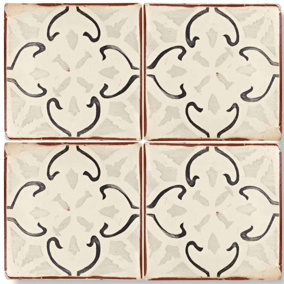 Cream-colored Marrakech Mabrouka patterned terracotta tile with black hand-painted floral patterns and rustic brown border