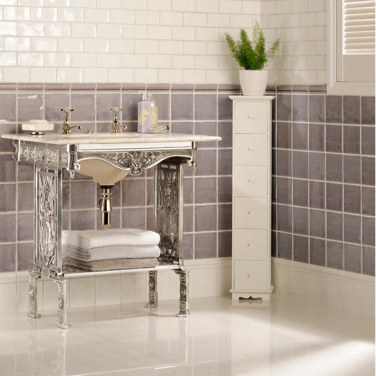 Silver ornate bathroom vanity with white marble top and undermount sink from marsh field tile collection