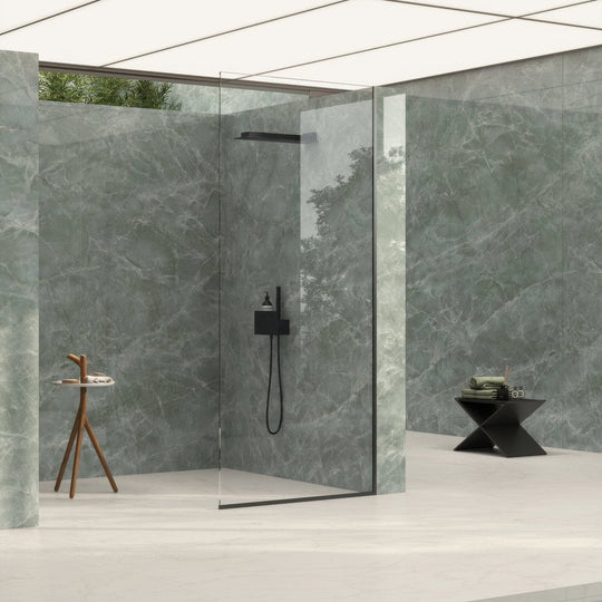 Marvel Diva Aqua Polished green marble-effect tiles with a black showerhead