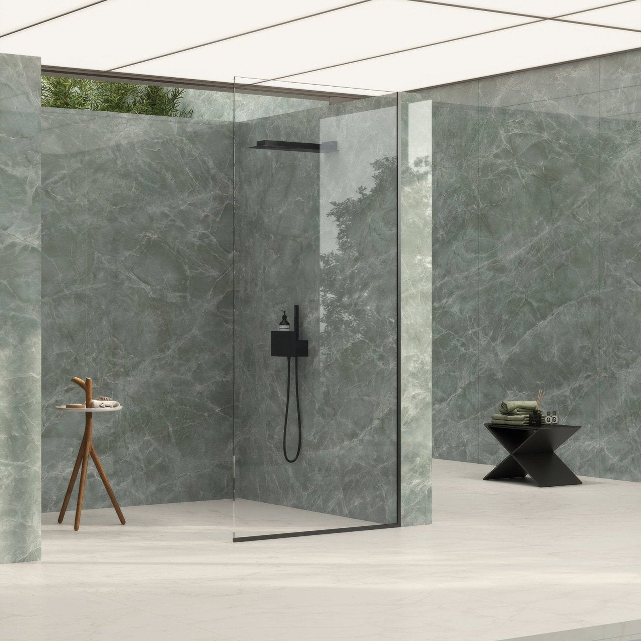 Marvel Diva Aqua Polished green marble-effect tiles with a black showerhead