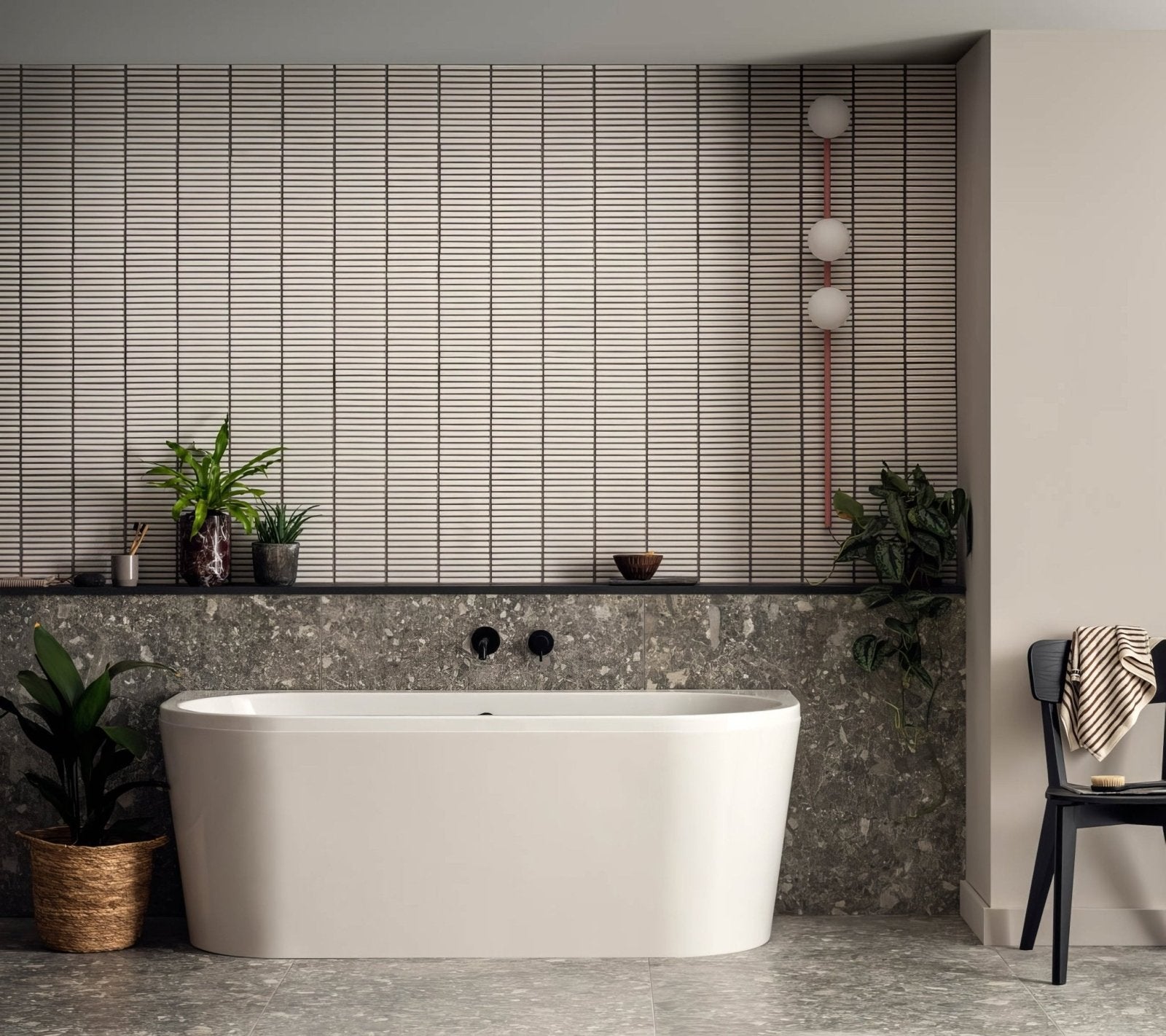 Matchstick Ice white glass mosaic with a white freestanding bathtub
