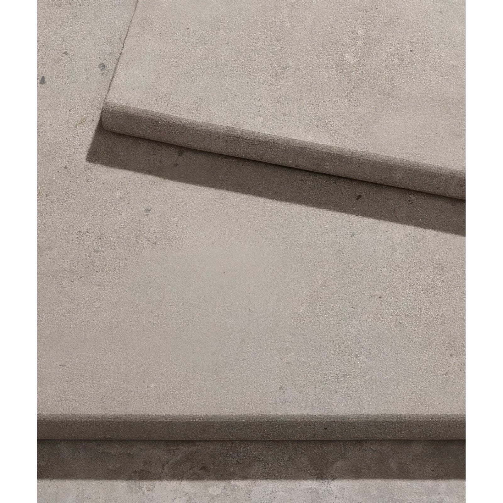 Beige matravers sandstone sawn bullnosed coping tiles with subtle texture and clean straight edges