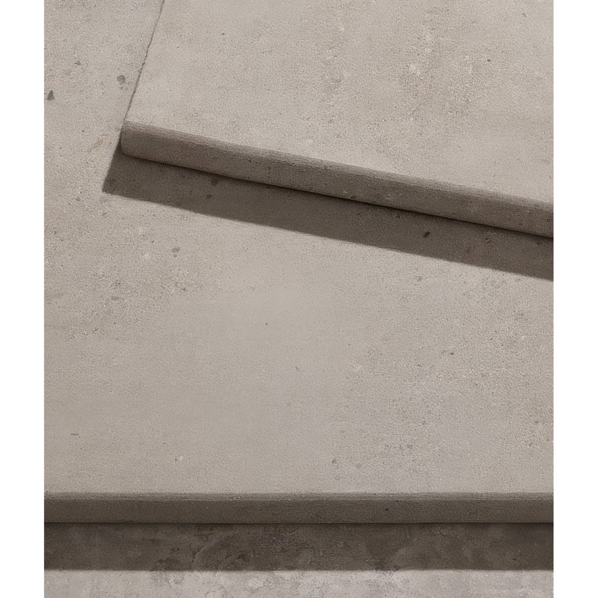 Beige matravers sandstone sawn bullnosed coping tiles with subtle texture and clean straight edges