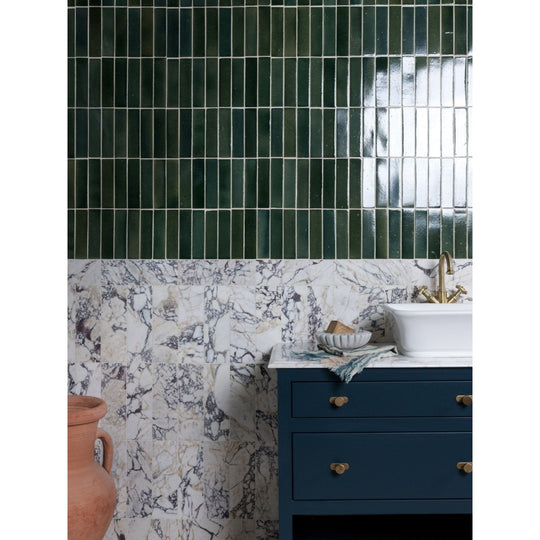 Deep green glossy rectangular medici viola marble honed brick tiles arranged in a vertical grid pattern
