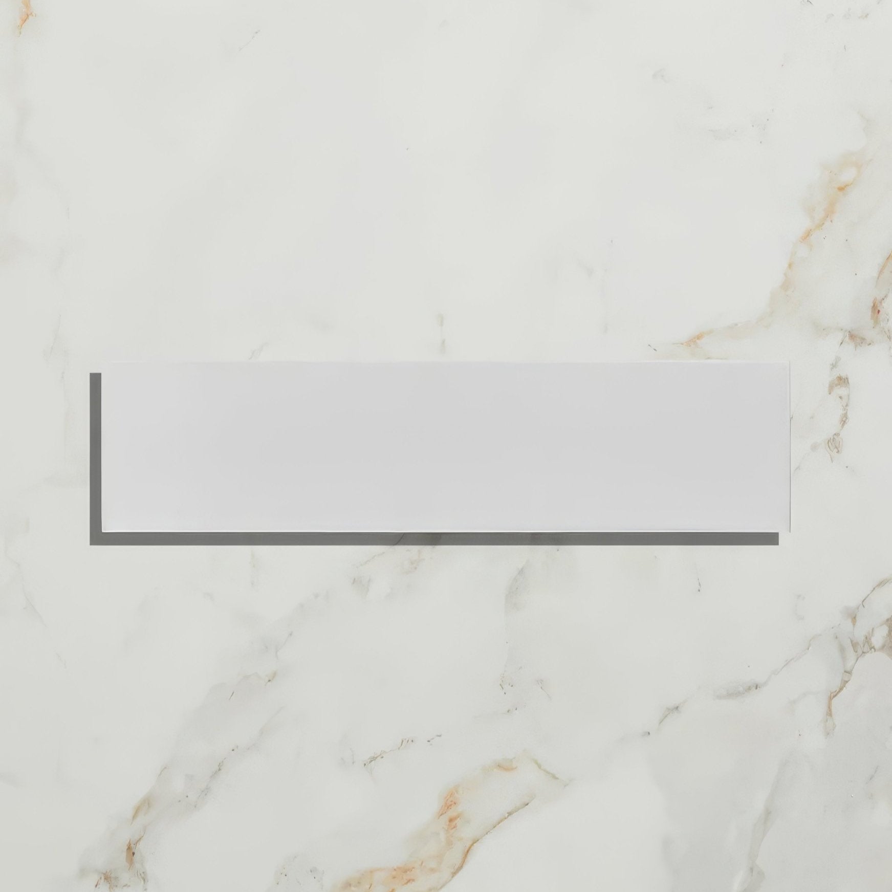 Medina Brick Porcelain Latte off-white porcelain brick tile on a marble surface