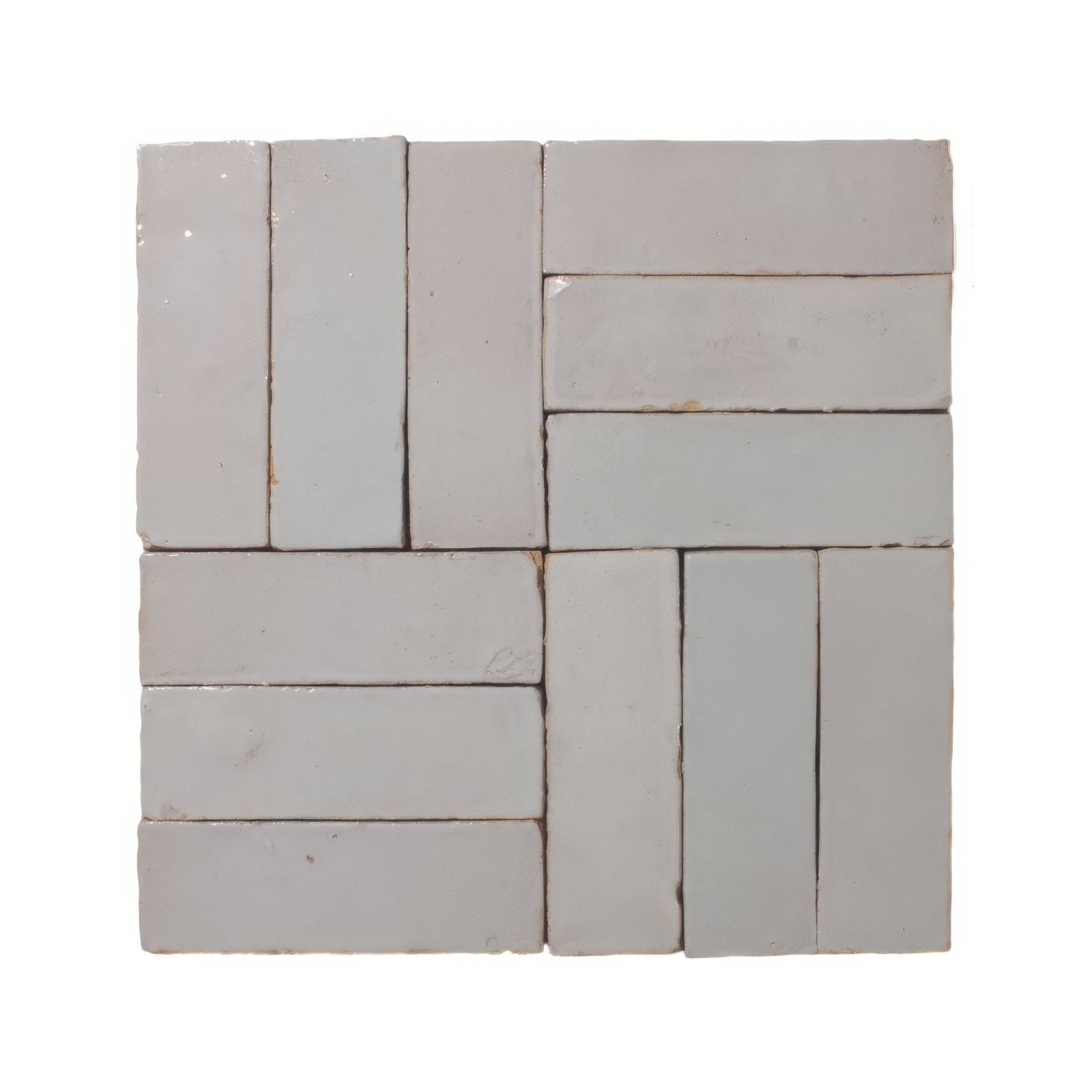 Medina pure white zellige rectangle light gray ceramic tiles arranged in a herringbone pattern