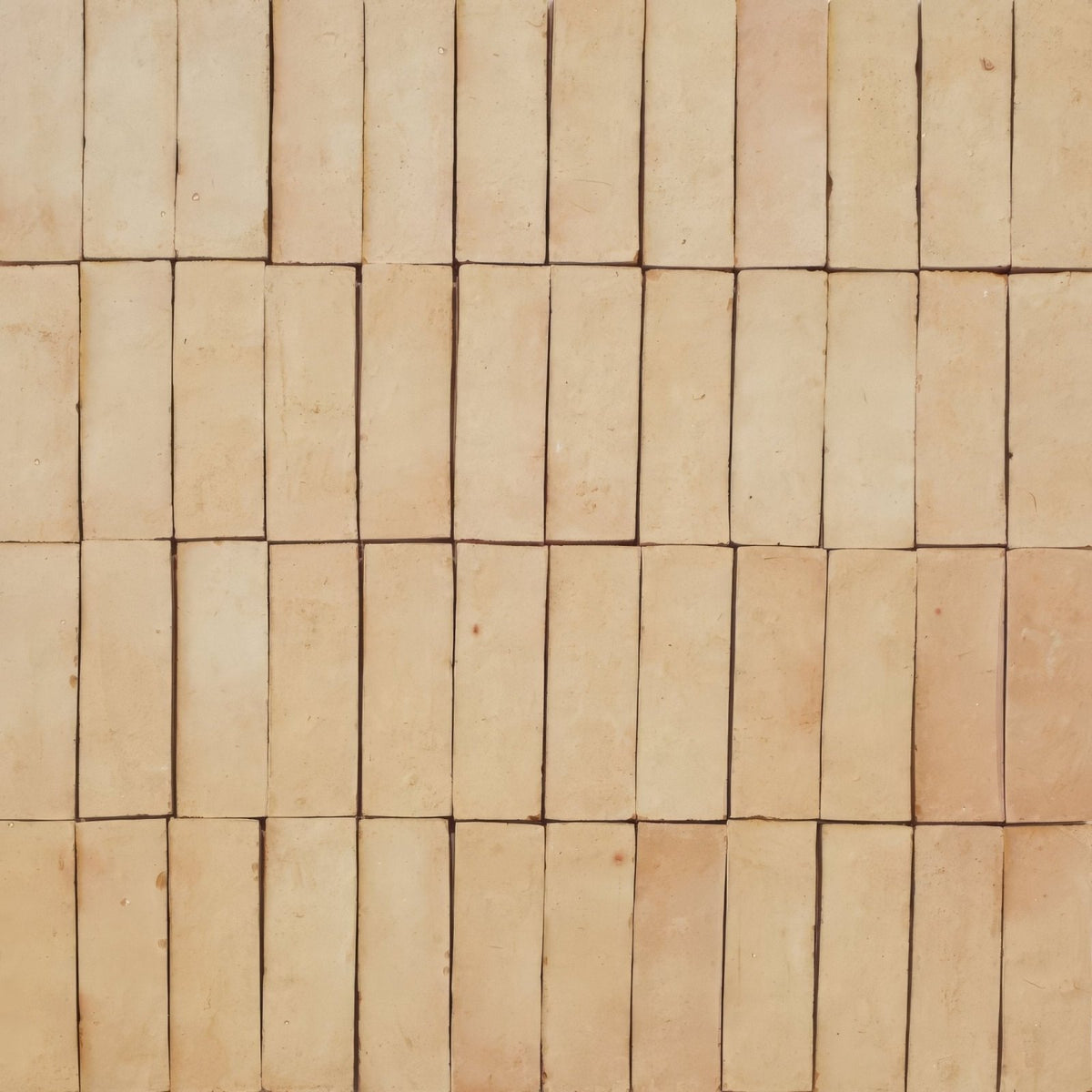Beige rectangular zellige tiles arranged in a grid pattern showcasing the medina raw zellige rectangle design