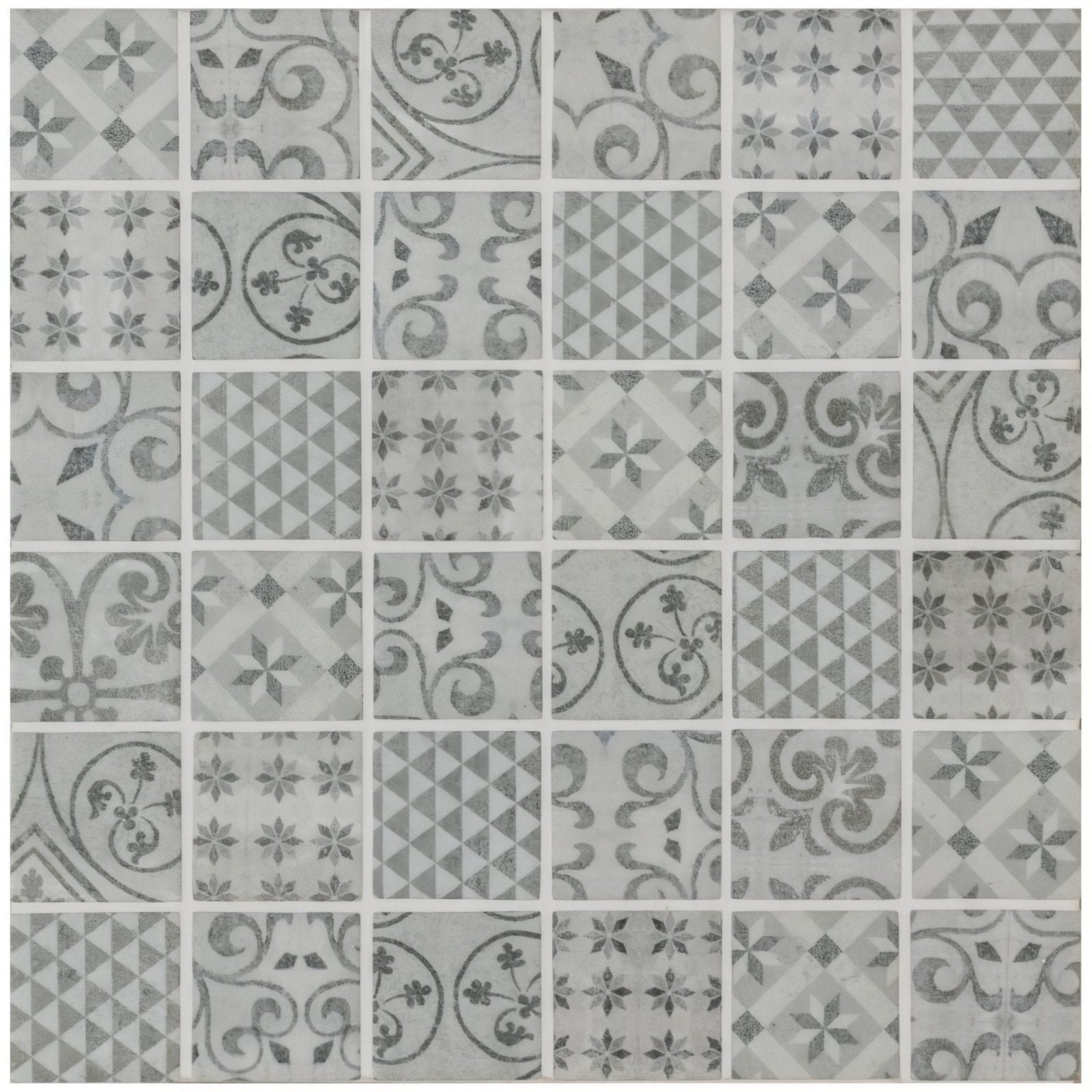 Medine patterned mosaic gray mosaic tile with vintage inspired patterns in varying shades of gray on light background