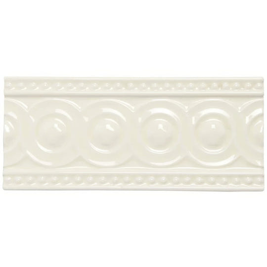 Cream-colored ceramic Melford Baroque tile with raised circular pattern and decorative beaded borders