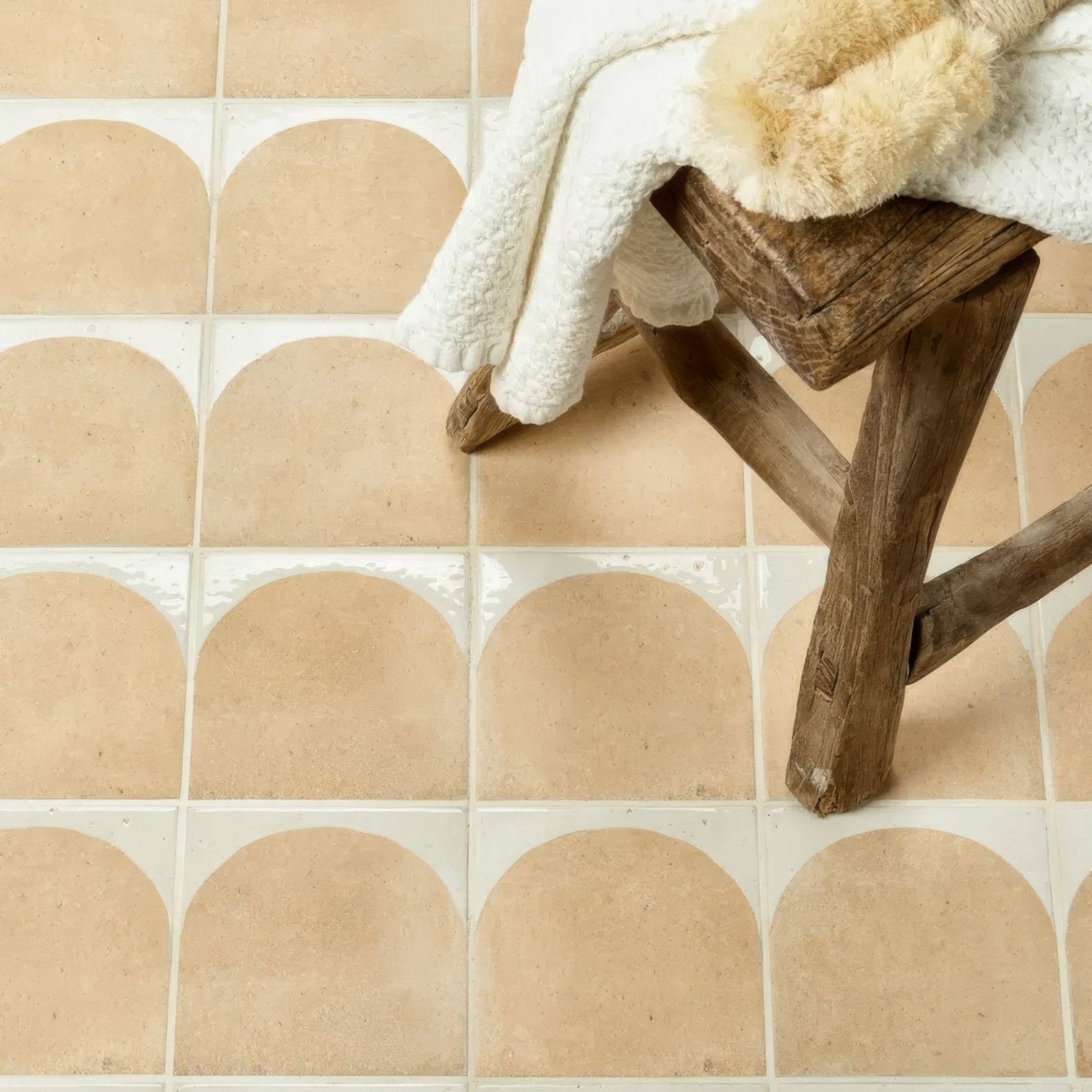 Beige menara cotto arches porcelain tiles with arched rounded tops and white grout lines in ceramic finish