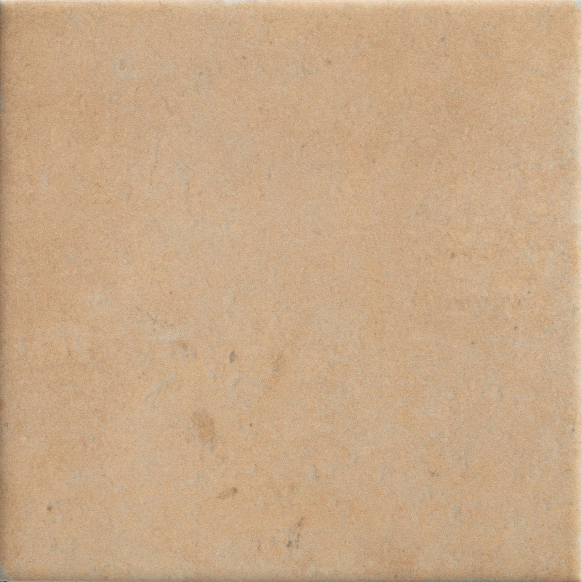 Beige menara cotto porcelain matt square tile with subtle texture and faint natural veining on a matte surface