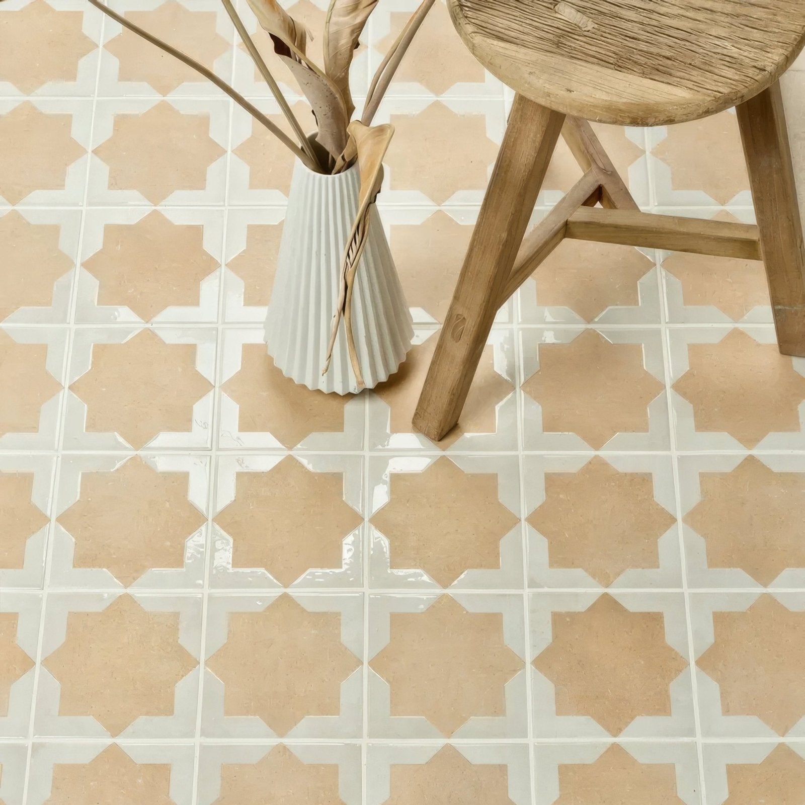 A white fluted ceramic vase with tapered shape vertical ridges from menara cotto star porcelain collection