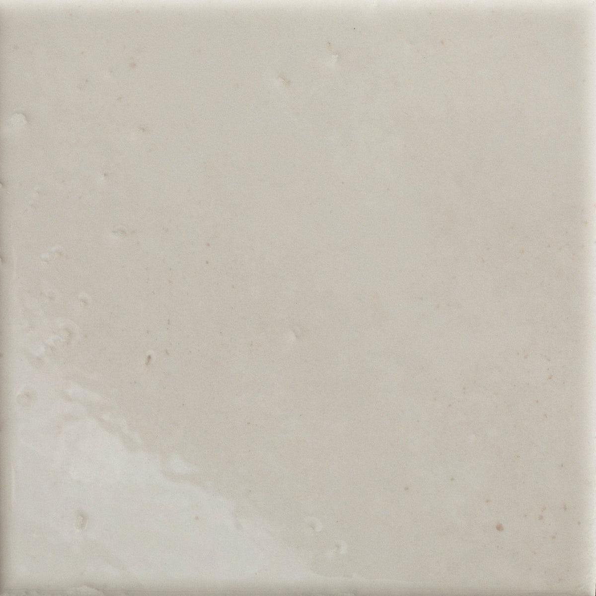 Cream-colored menara white porcelain gloss square tile with smooth slightly textured surface and subtle natural veining