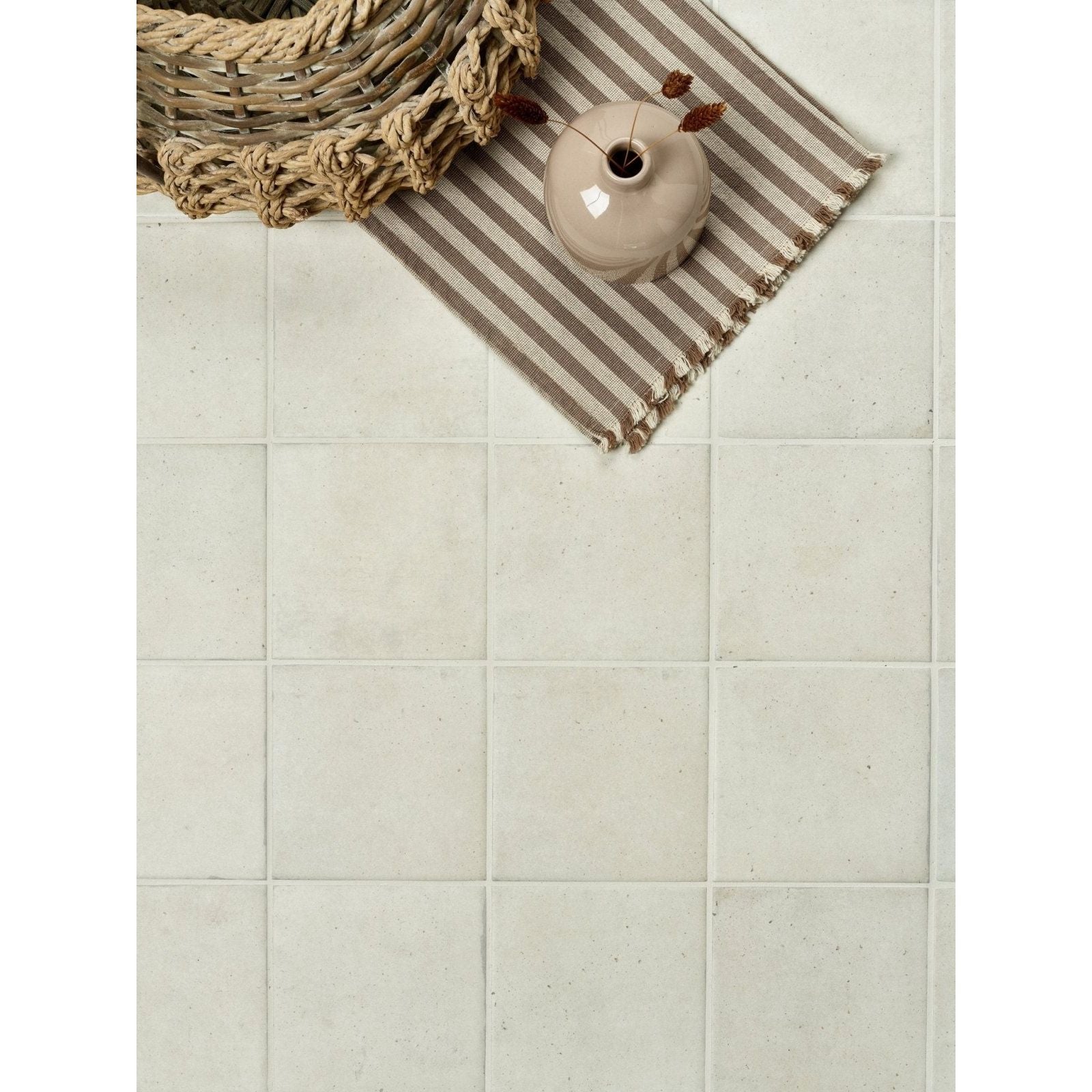 Beige ceramic vase with subtle textured surface and small opening from menara white porcelain matt collection