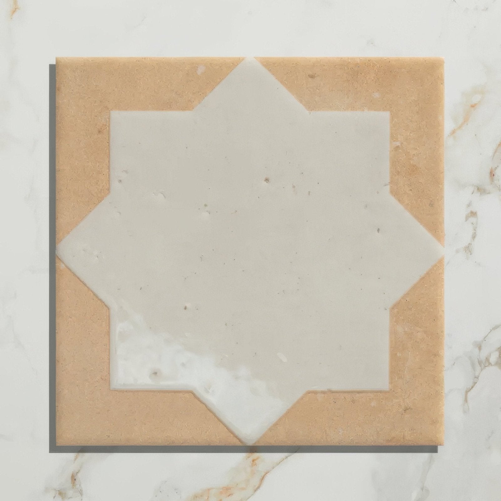Menara white star porcelain square mosaic tile with central white star inset and beige textured stone-like border
