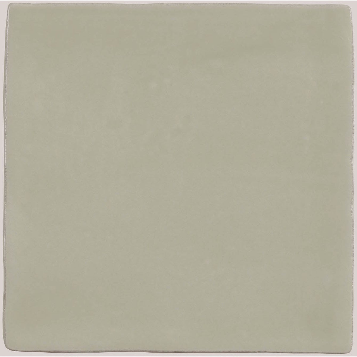 A square matte-finished ceramic tile in soft sage green from the mere field tile collection