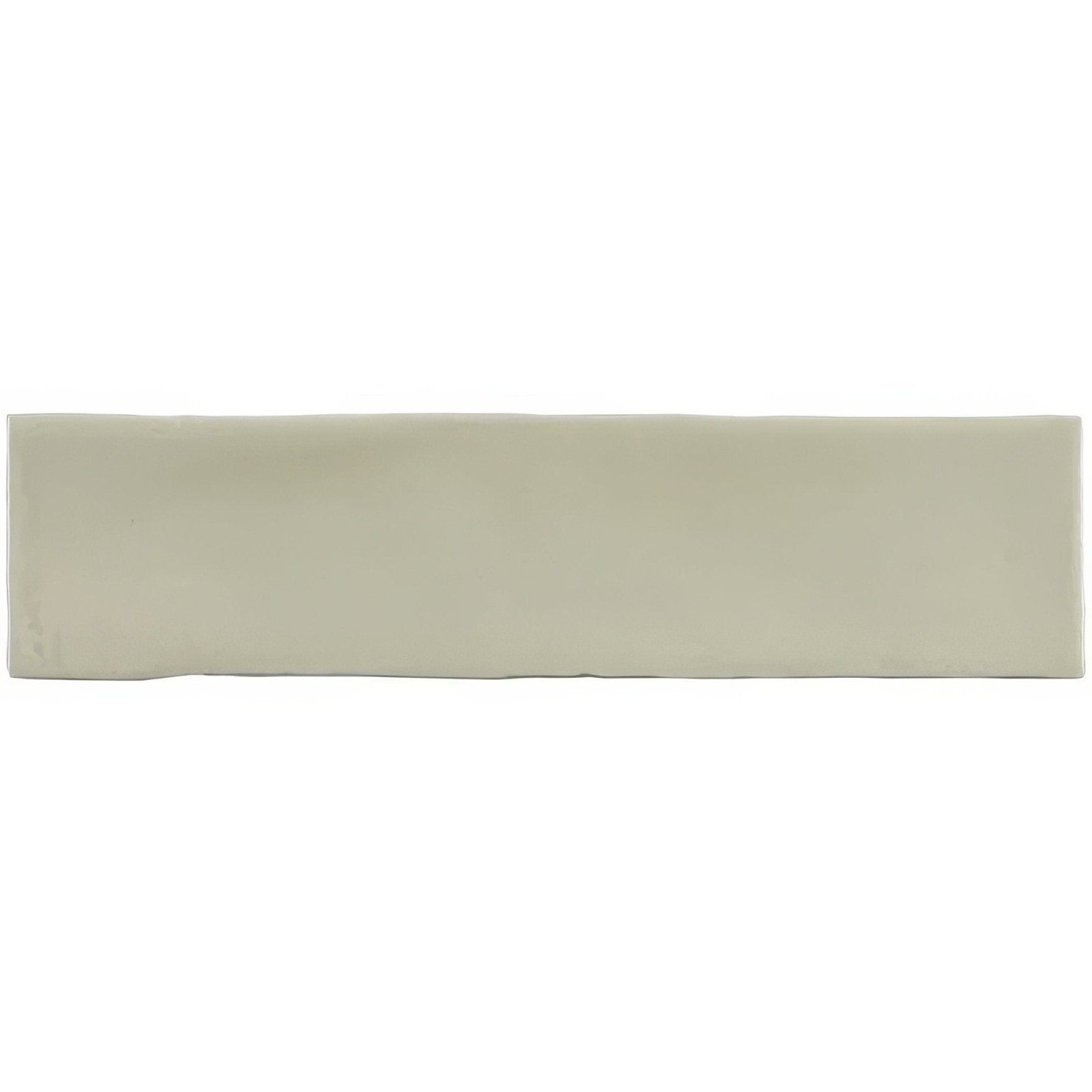 A sleek rectangular ceramic Mere Large Brick Tile with a smooth matte finish in soft sage green hue