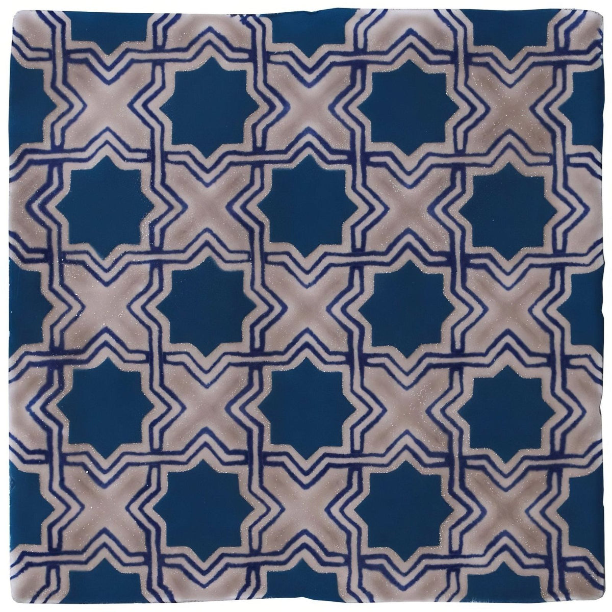 Merles on truffle tile with blue and beige geometric star-shaped patterns for decorative flooring and walls
