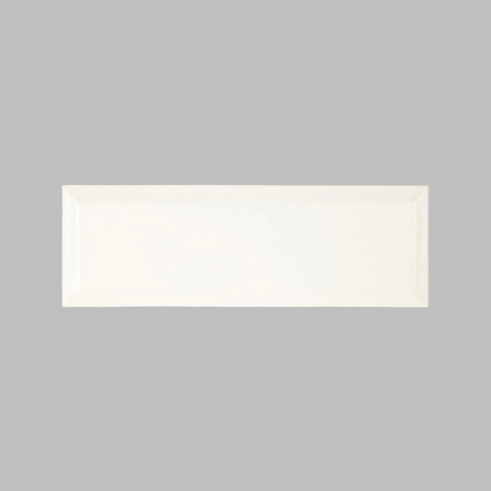 A sleek rectangular white ceramic metropolitan queensway glazed metro tile with smooth glossy finish and raised edges