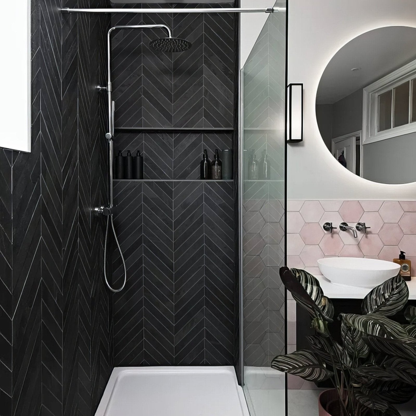 Modern black metropolitan slate chevron riven finish herringbone tiled shower wall with built-in shelves and chrome rainhead