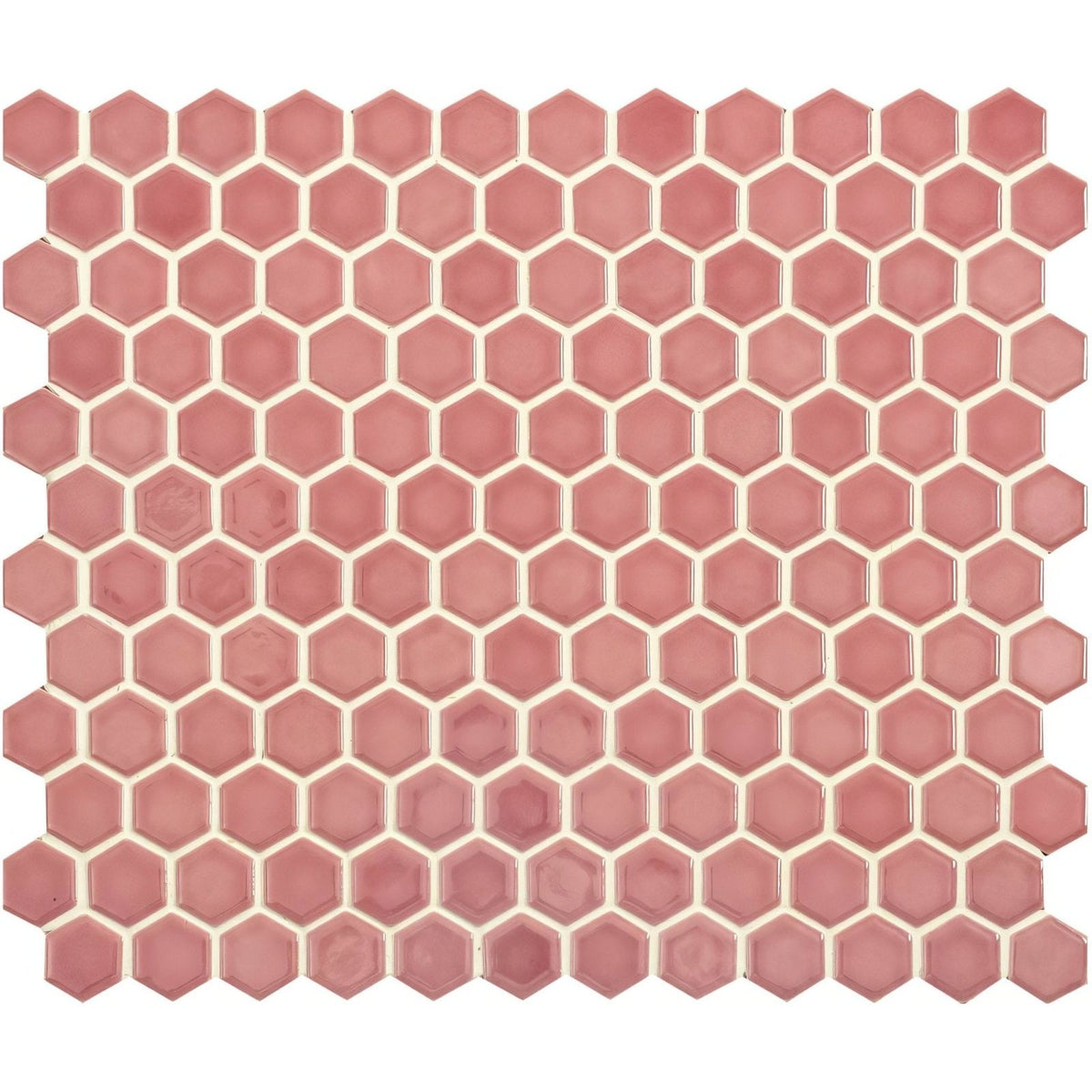 Mini pink gloss hexagon tile featuring pink hexagonal mosaic design with cream-colored grout for wall or floor use