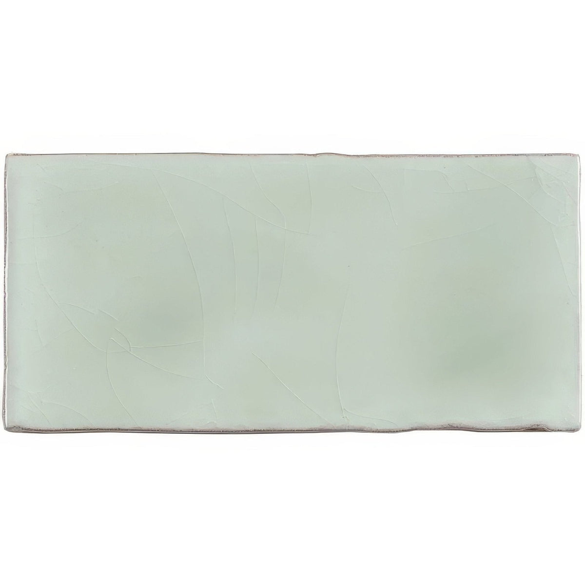 A rectangular matte finished ceramic wall tile in soft mint green with subtle surface texture for half tile use