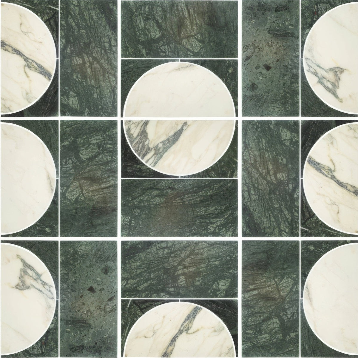 Circular white marble tiles with dark veining paired with textured deep green monet luna verde stone panels