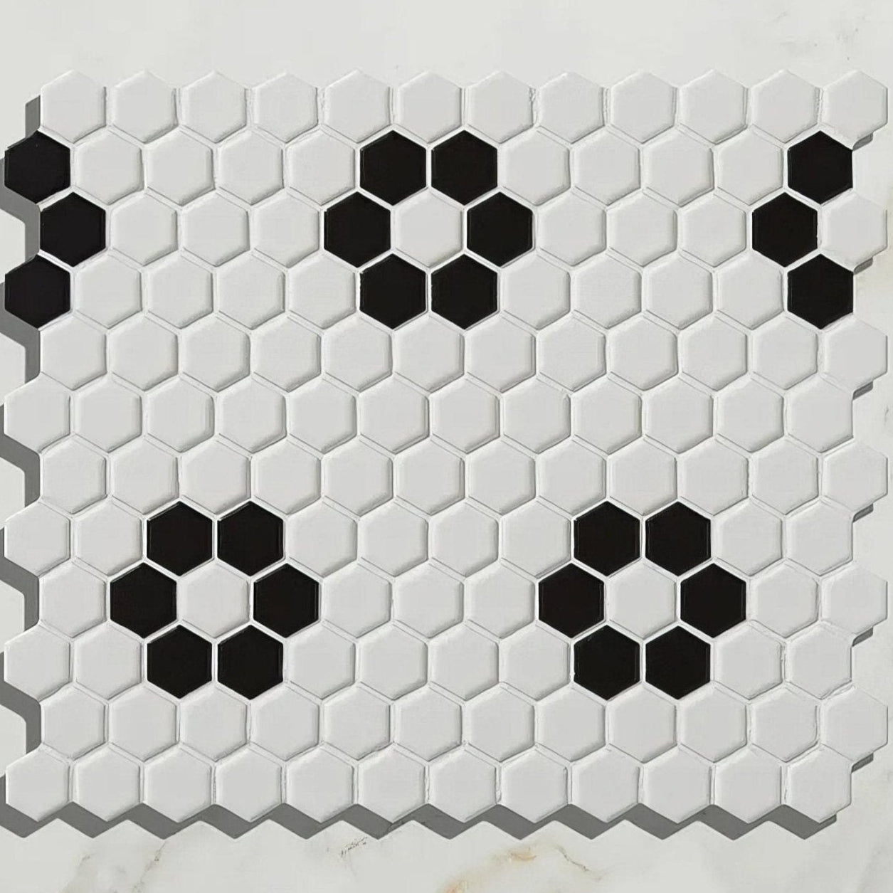 Black and white hexagonal porcelain mosaic tile with a modern geometric pattern for stylish interior design