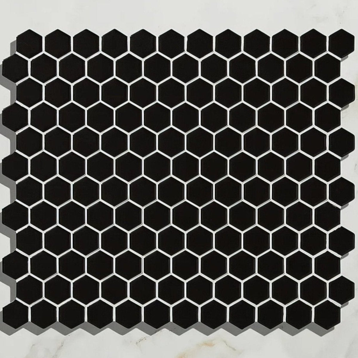 Mono hex porcelain mosaic noir shows black hexagonal tile with white grout lines for modern wall and floor design