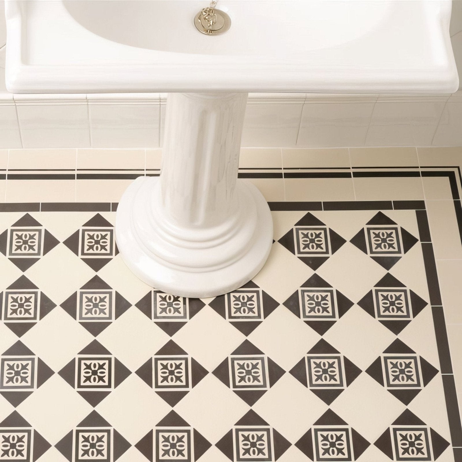 Black and cream diamond patterned ceramic bathroom floor tiles with intricate floral motifs montague black on dover white