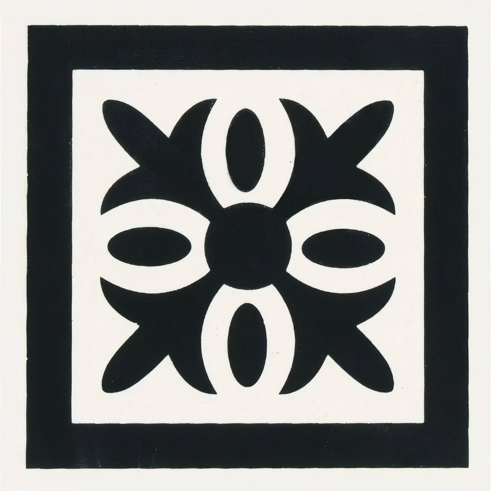 Montague black on dover white tile with black and white geometric pattern featuring symmetrical floral design