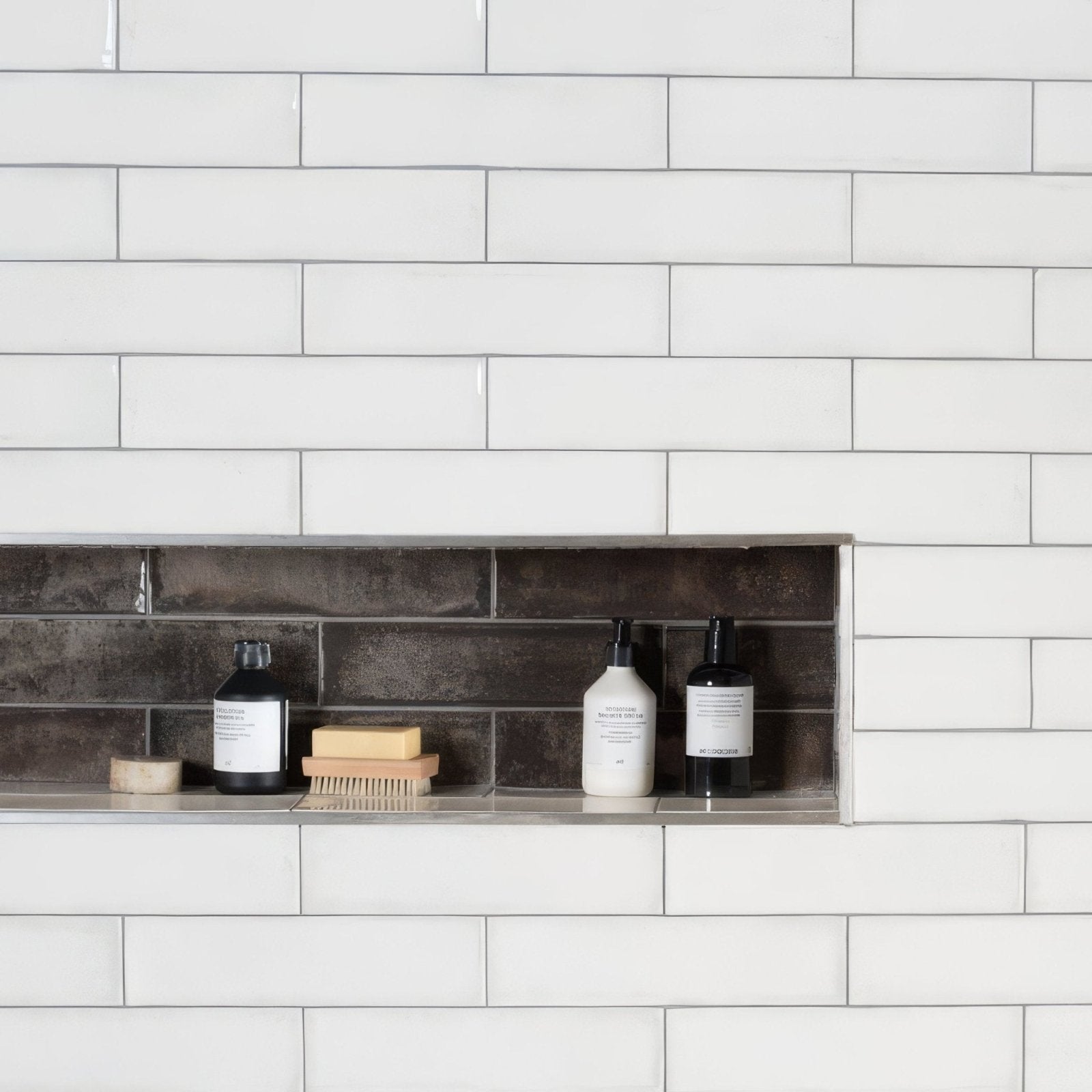 Montblanc white rectangular tile wall 30x7.5cm with recessed shelf holding three bottles and a brush
