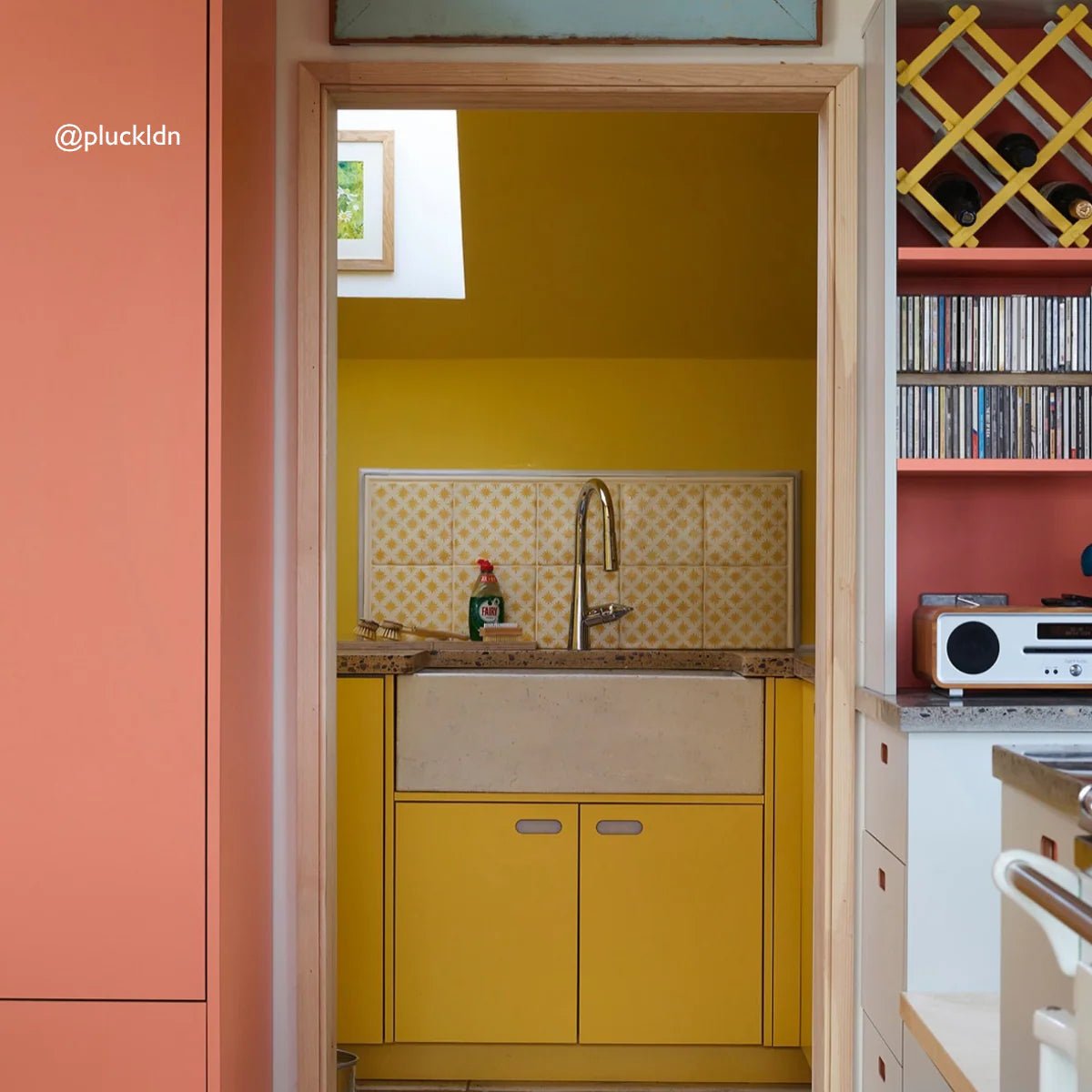 Yellow farmhouse sink neisha crosland atlas star anise buttercup with stainless steel faucet and beige tiled backsplash