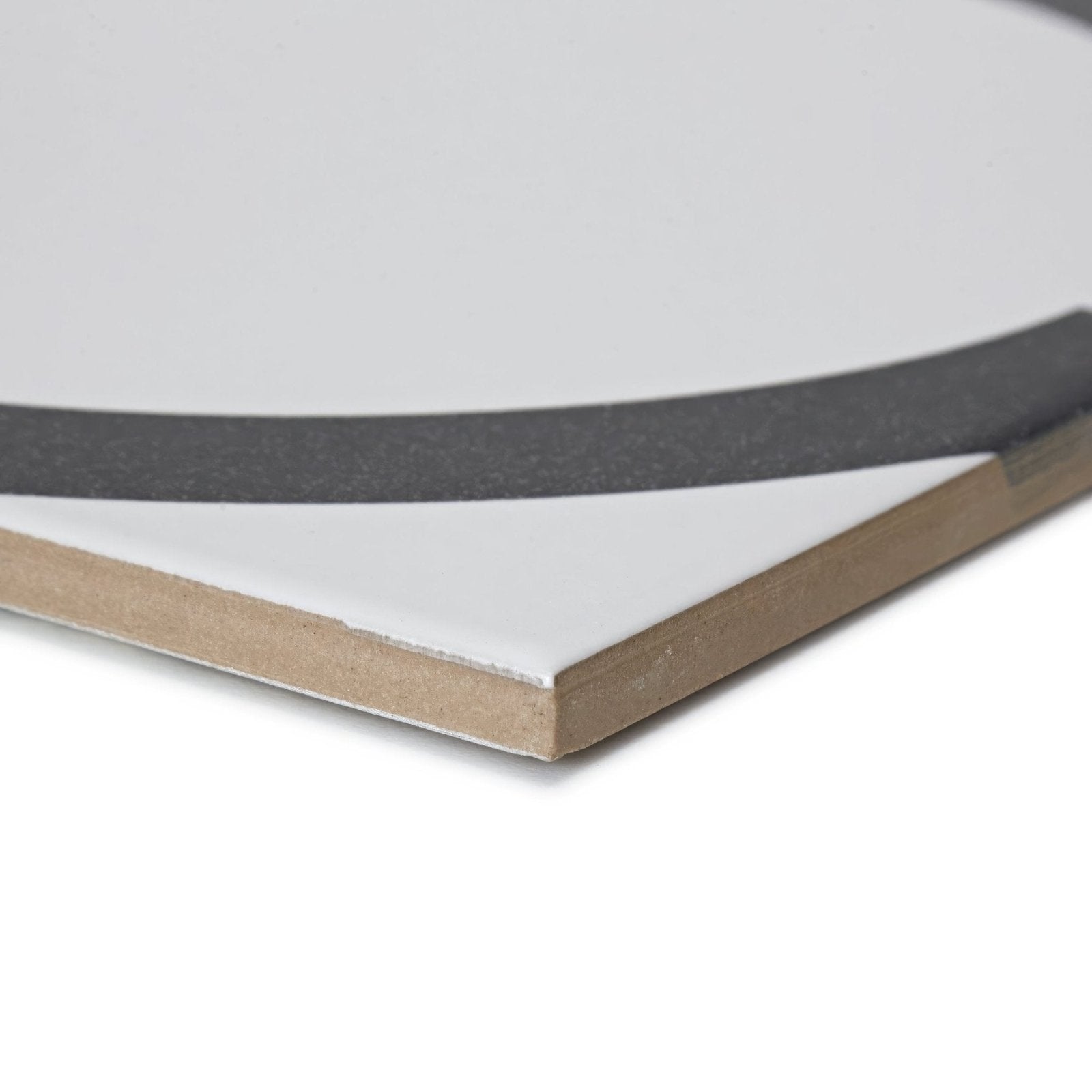 White ceramic tile with black adhesive strip and wood-core backing showing the back side of neisha crosland tulia hula hoop black