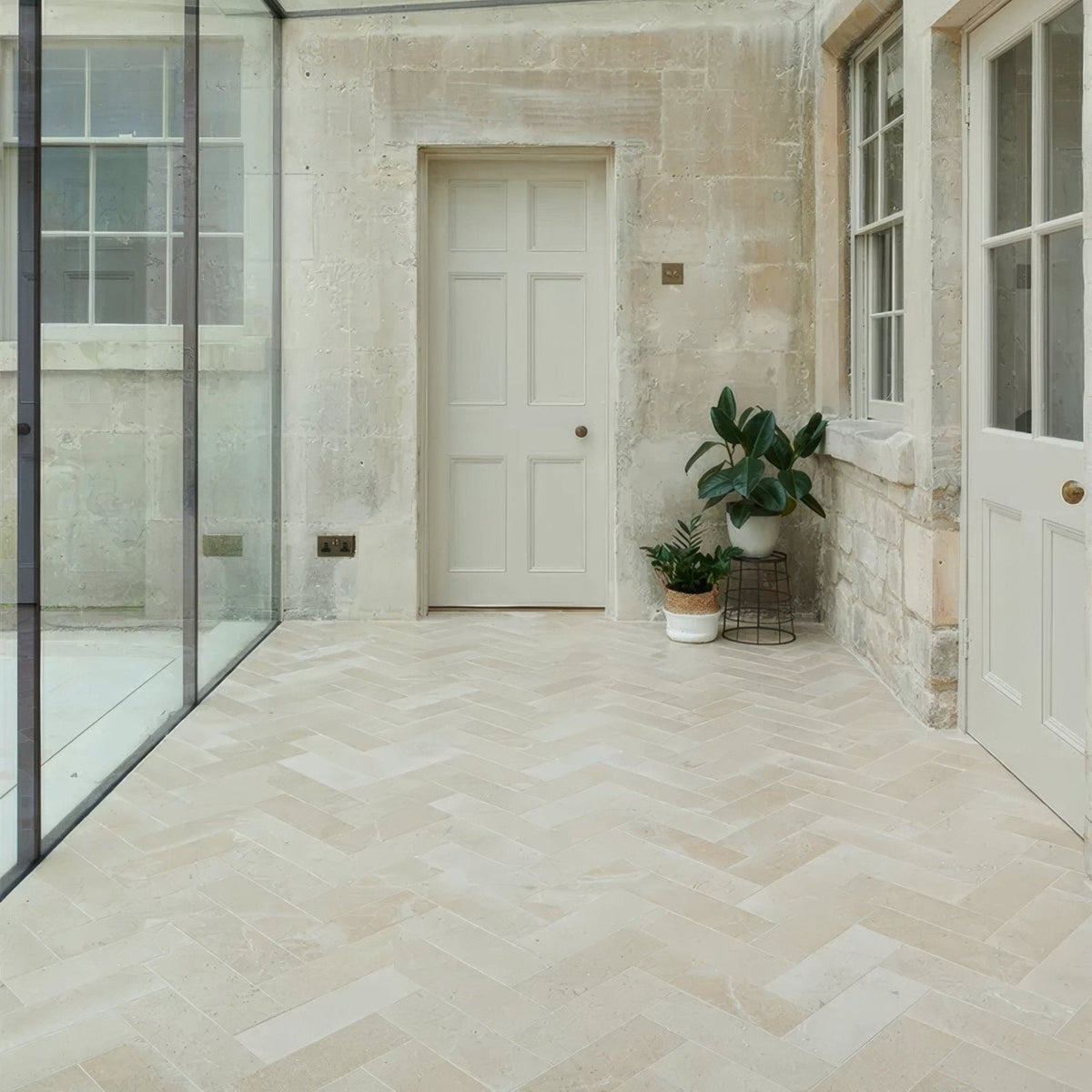 Beige herringbone patterned buscot limestone brick floor tiles with a velvet finish