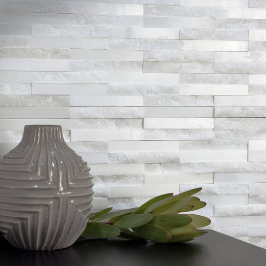 Neve Linear Stone Mosaic white marble linear mosaic with a grey ridged ceramic vase