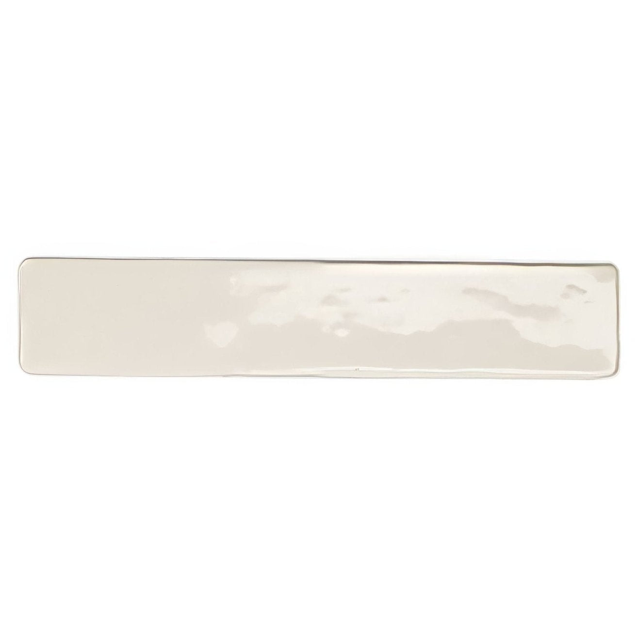 Cream-colored ceramic serving platter with subtle hammered texture from Nina Campbell Rivage ivory glazed wall tile collection